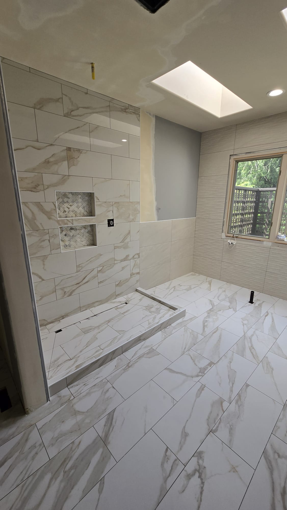 Walk-in shower prepared for custom glass panels