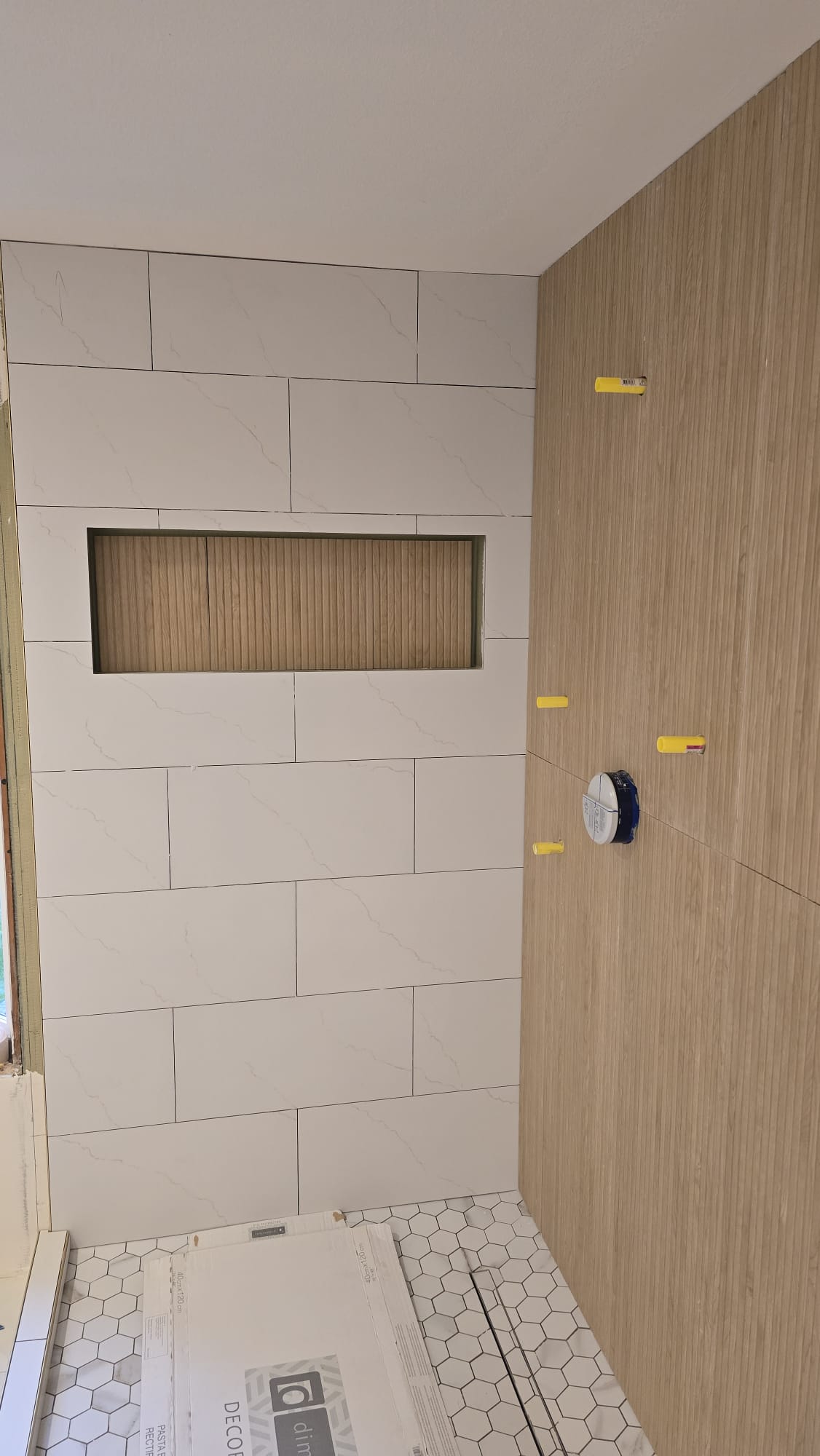 Tiled shower prepared for a frameless glass enclosure