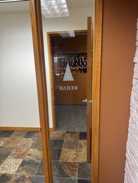 Interior commercial glass door with custom lettering