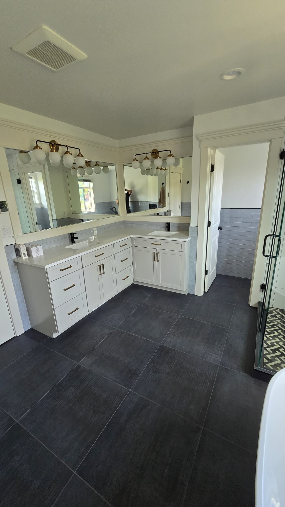 Custom corner mirrors above a double bathroom vanity
